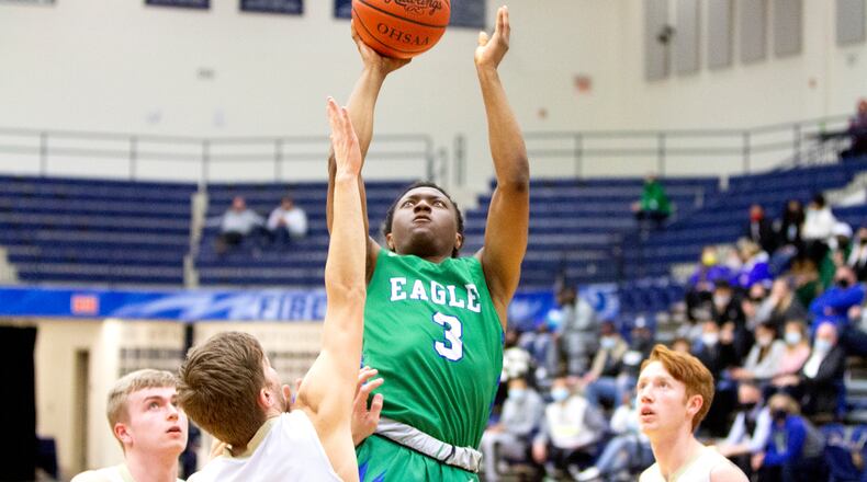 Chaminade Julienne junior Justin Morah scores during the first half of the Eagles' victory over Ben Logan in a Division II sectional game at Trent Arena. Jeff Gilbert/CONTRIBUTED