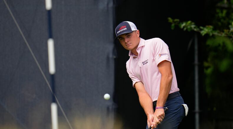 Austin Greaser hits on the 16th hole during the first round of the U.S. Open golf tournament at The Country Club, Thursday, June 16, 2022, in Brookline, Mass. (AP Photo/Julio Cortez)