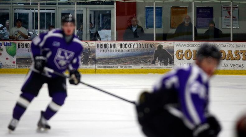 An advertisement supporting bringing an NHL team to Las Vegas is pictured on boards at the Las Vegas Ice Center during a Las Vegas Storm game in Las Vegas, Jan. 15, 2016. Las Vegas has long been shut out of major professional sports, largely because of its ties to legal gambling. But a new arena is scheduled to open in April and a committed ownership group has sold roughly 13,500 season tickets for a prospective NHL franchise. (Isaac Brekken/The New York Times)