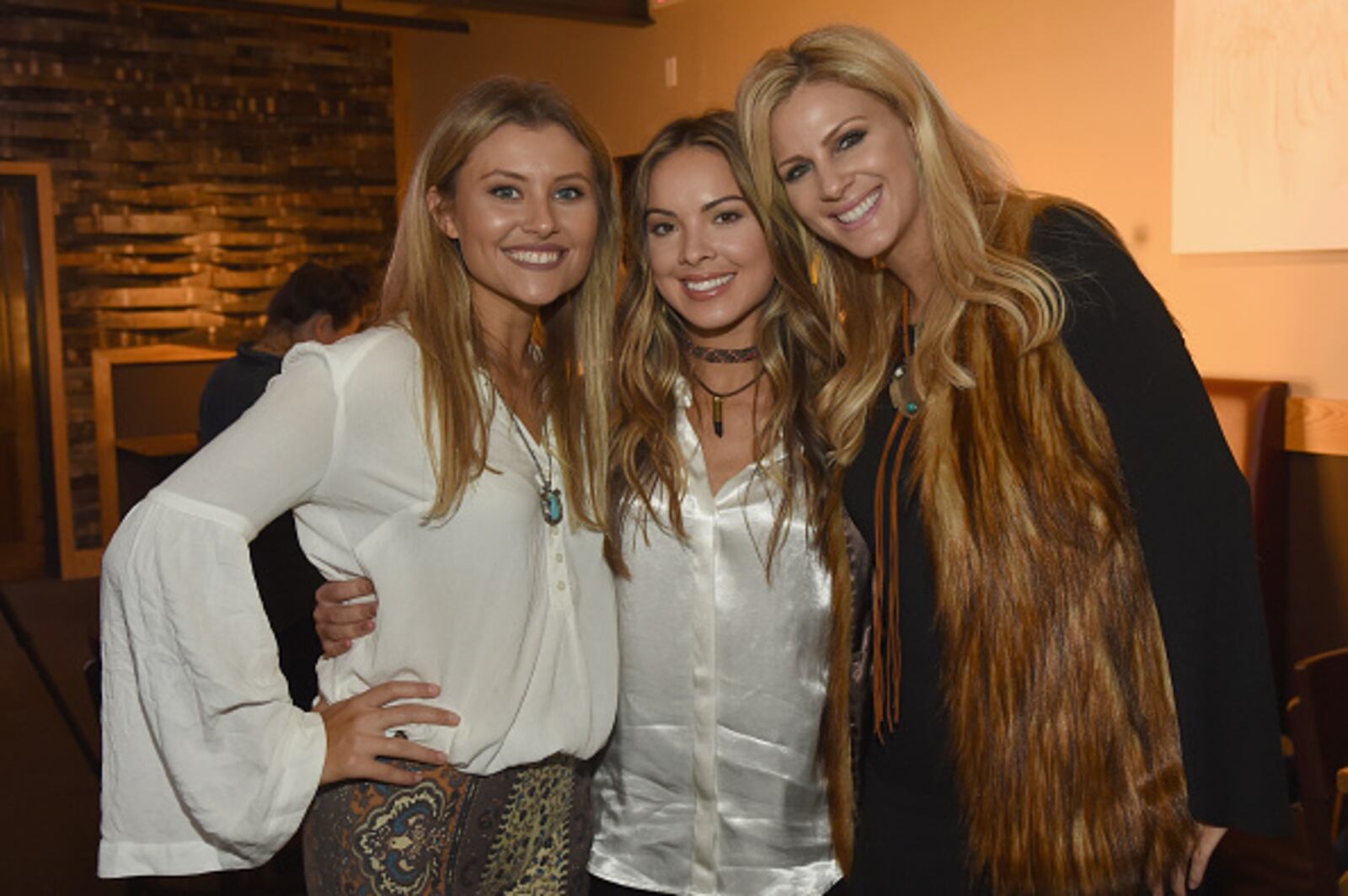 NASHVILLE, TN - NOVEMBER 01:  Singer-songwriters Hannah Mulholland, Naomi Cooke and Jennifer Wayne of Runaway June take photos together before CMT's Next Women of Country on November 1, 2016 in Nashville, Tennessee.  (Photo by Rick Diamond/Getty Images for CMT)