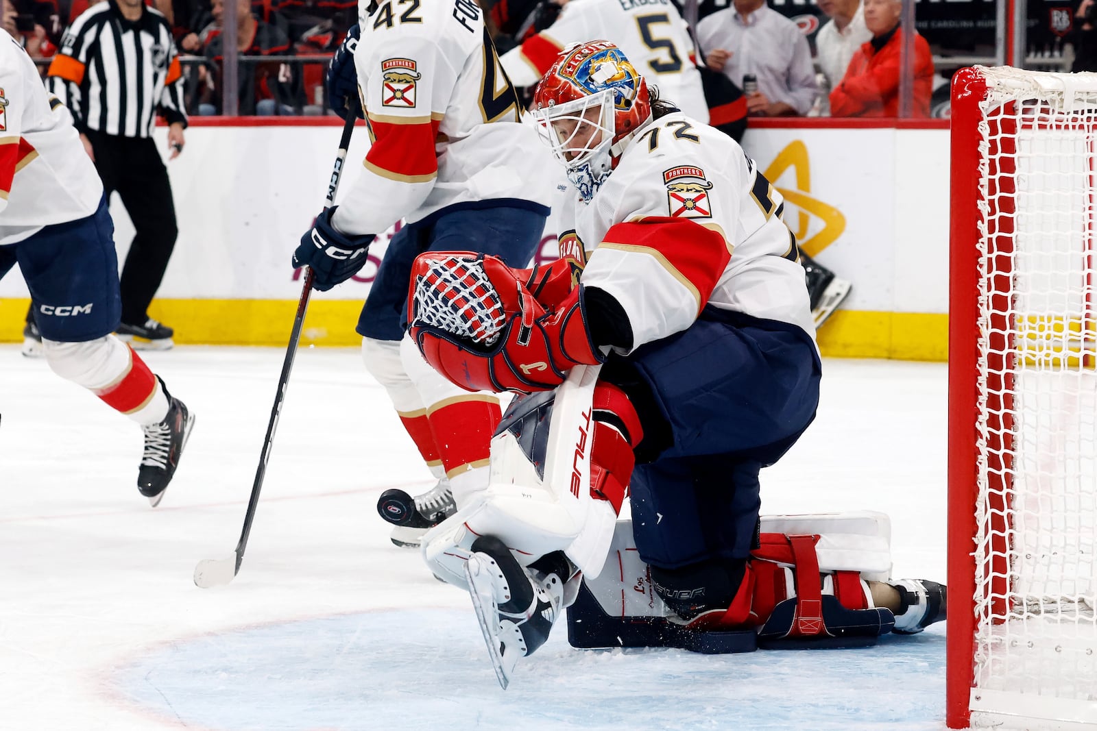 Florida Panthers goaltender Sergei Bobrovsky (72) blocks a shot from the Carolina Hurricanes during the second period of Game 1 of the NHL hockey Stanley Cup Eastern Conference finals in Raleigh, N.C., Tuesday, May 20, 2025. (AP Photo/Karl DeBlaker)