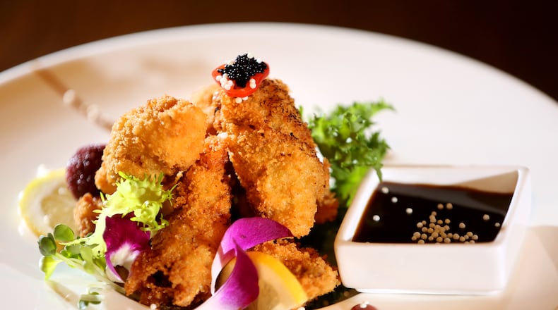 Fried oysters at Ozu 852 are topped with black caviar and served with tonkatsu sauce.Ozu 852 has won the Best Asian Food category in the Best of Dayton contest for numerous years. The restaurant, located at 852 Union Blvd. in Englewood, is known for fresh, quality sushi, hibachi, Chinese and Japanese foods.  LISA POWELL / STAFF