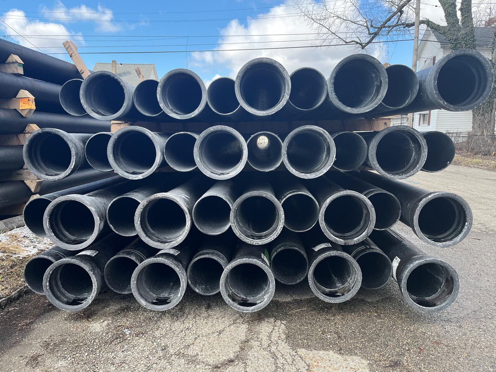 Water pipes stacked up on Bierce Avenue in East Dayton. CORNELIUS FROLIK / STAFF