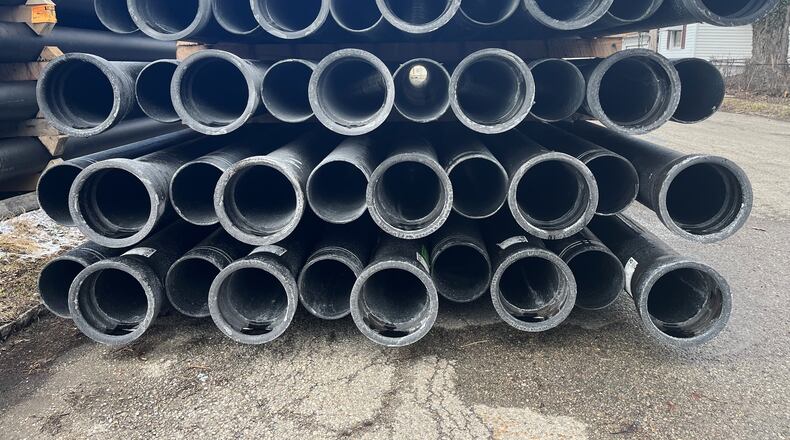 Water pipes stacked up in East Dayton. CORNELIUS FROLIK / STAFF FILE