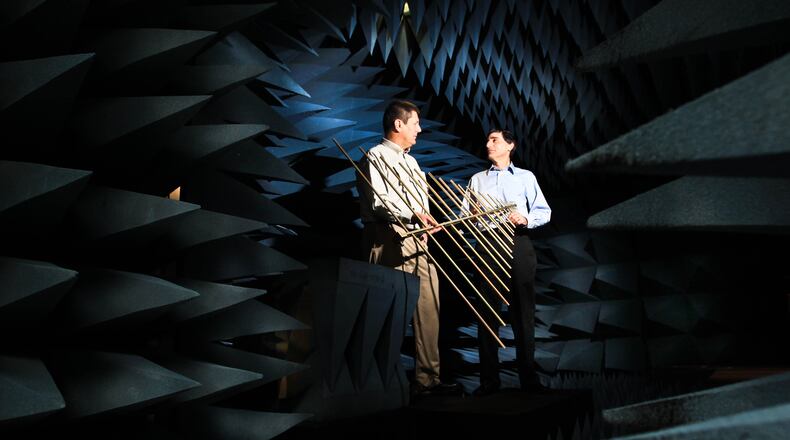 Left, Bob Taylor, senior engineer, and Dale DeThomas, senior program manager, stand in the anachoic chamber used for radio frequency testing at MacAuley-Brown in this 2013 file photo.