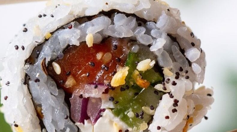 A Fusian Philadelphia Roll, one of several new menu items at the restaurant chain founded by three Oakwood grade school classmates.