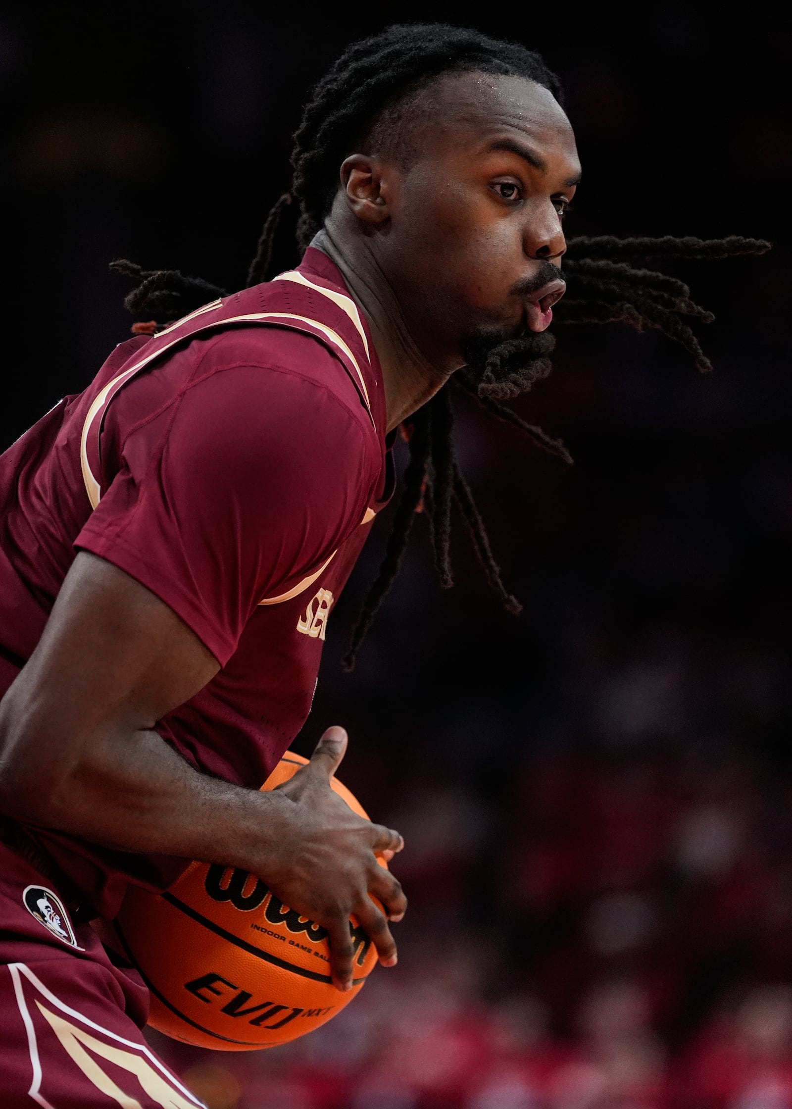 Florida State guard Robert McCray V controls the ball during the second half of an NCAA college basketball game against Houston in Houston, Saturday, Dec. 6, 2025. (AP Photo/Ashley Landis)