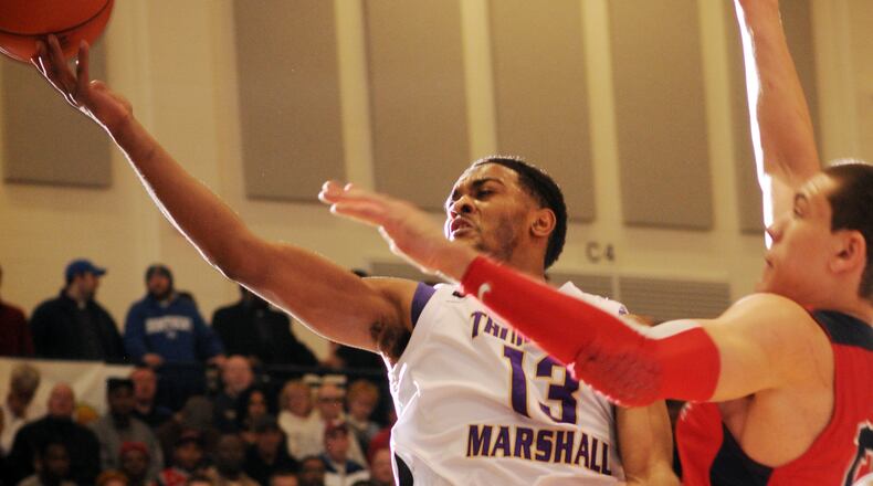 Mark Alstork of Thurgood Marshall flies to the hoop inthe second half of the opening game of the Flyin to the Hoop Tournament Friday Night at Trent Arena