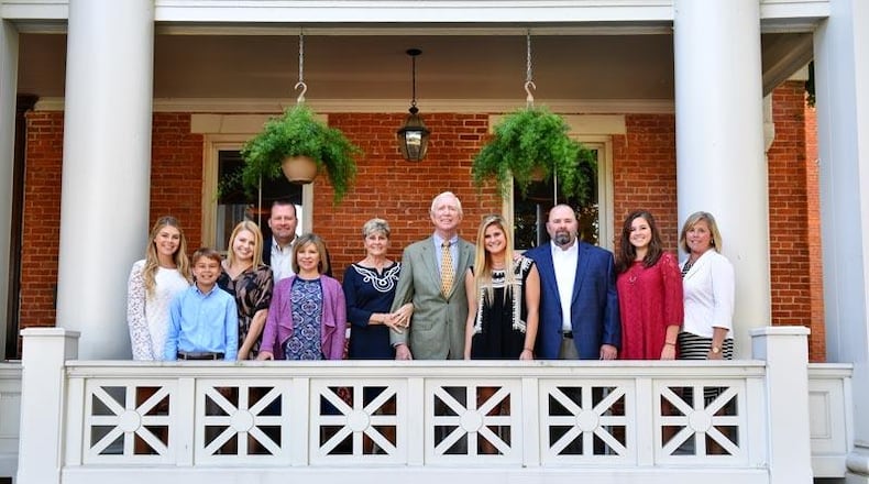 The owner of 10 Wilmington Place with his family on the front porch of the building. L-R Jessica Williams, Ryan Williams, Hannah Williams, son Joe Williams, daughter in law Laura Williams, wife Marilyn Humphries, owner Barry Humphries, Lauren Williams, son John Williams, Elizabeth Williams, daughter in law Terri Williams. CONTRIBUTED