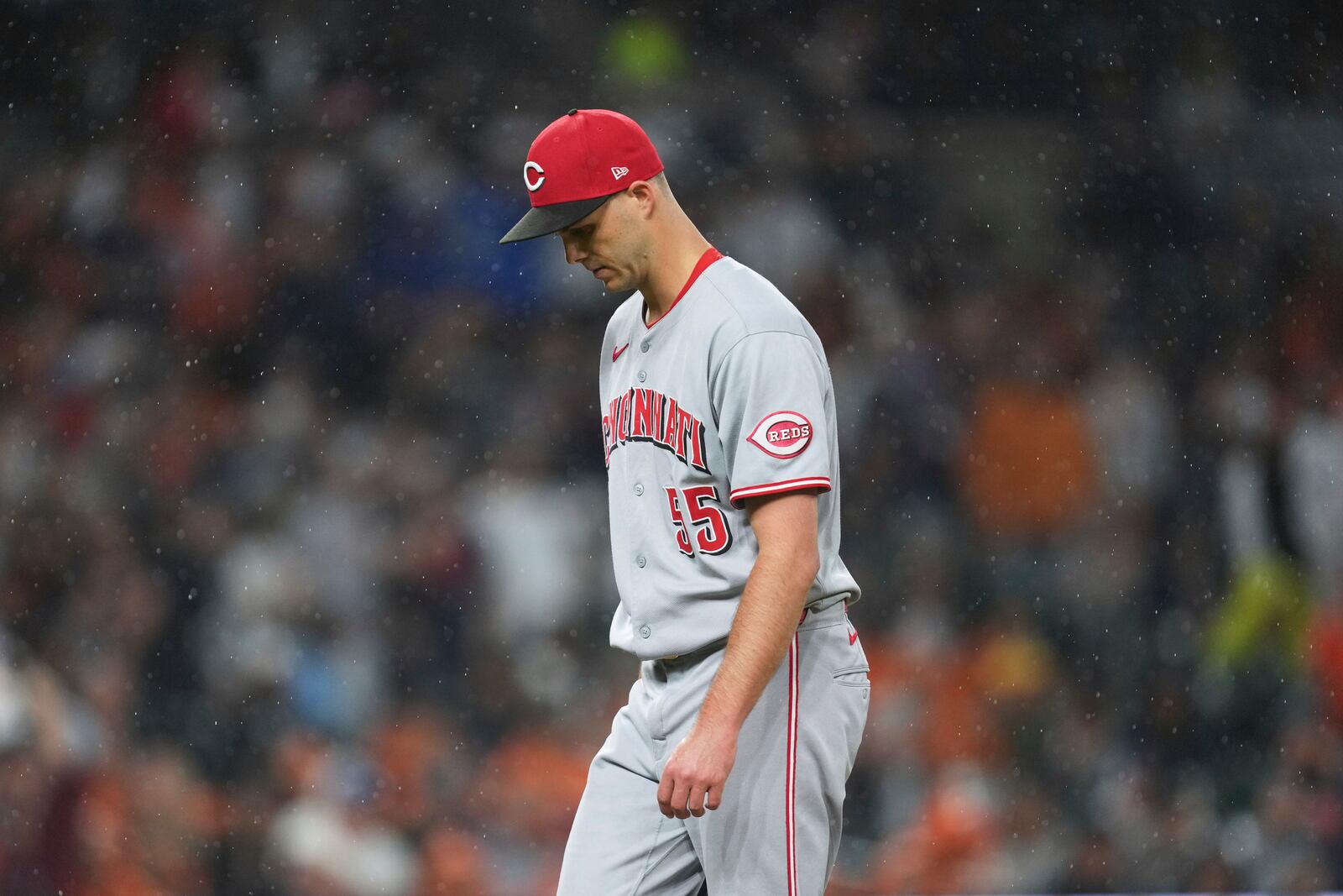 Cincinnati Reds pitcher Taylor Rogers walks to the dugout against the Detroit Tigers in the sixth inning during a baseball game, Friday, June 13, 2025, in Detroit. (AP Photo/Paul Sancya)