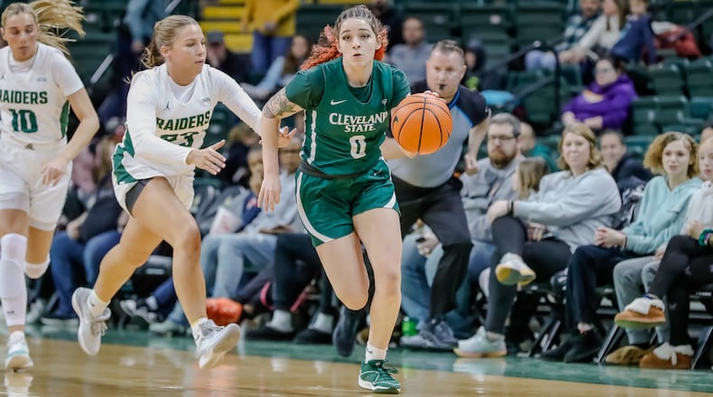 Cleveland State University's Mickayla Perdue, a Springfield High School graduate, is chased by Wright State University's Macie Taylor during their game on Wednesday, Jan. 17. Michael Cooper/CONTRIBUTED