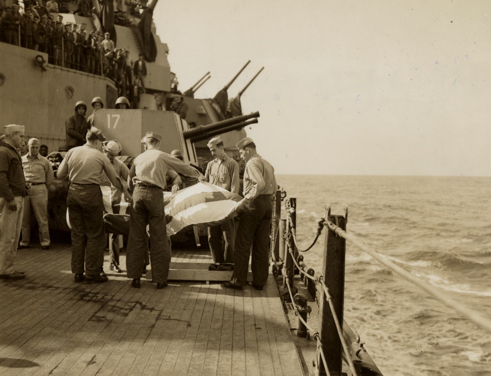 This image provided by the U.S. National Archives shows a burial at sea of the remains of a Japanese pilot whose plane hit the USS Missouri on April 11, 1945. (U.S. National Archives photo no. 80-G-315823 via AP)