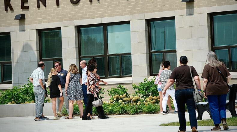 Community members are shown outside the new Kenton Ridge school as officials conducted a ribbon-cutting and building dedication ceremony Saturday, Aug. 19, 2023. The new school will house all Kenton Ridge students. MARSHALL GORBY\STAFF