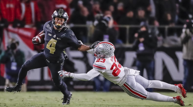 Rondale Moore #4 of the Purdue Boilermakers runs the ball and tries to fight off Jahsen Wint #23 of the Ohio State Buckeyes at Ross-Ade Stadium on October 20, 2018 in West Lafayette, Indiana. (Photo by Michael Hickey/Getty Images)