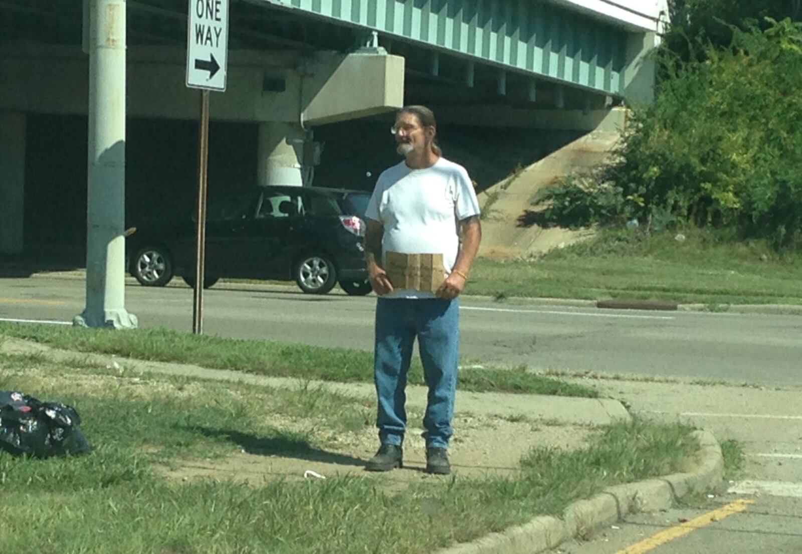 Since Dayton changed its laws on panhandling in August, the city's intersections have seen an explosion of people begging for money. BRIAN KOLLARS / STAFF