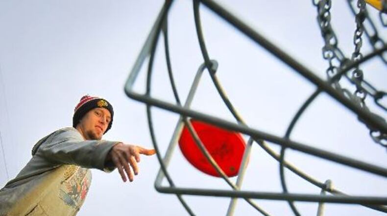 Ryan Hale was one of the key contributors of the 18-hole disc golf course at the Tipp City Park made possible in 2013 with funding from donors and the city. JIM WITMER / STAFF