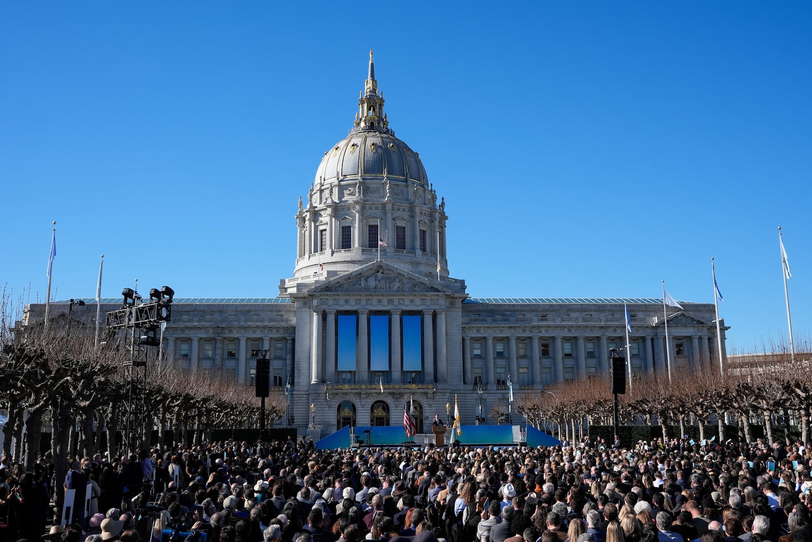 FILE - The crowd watches as Mayor Daniel Lurie, center, delivers his inaugural address outside City Hall, Wednesday, Jan. 8, 2025, in San Francisco. (AP Photo/Godofredo A. Vásquez, File)