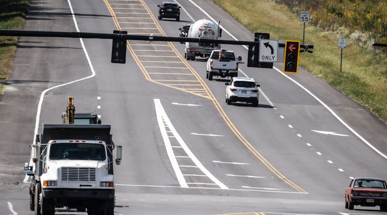 Vehicles are shown driving on U.S. 40 just west of the Dayton International Airport and near the intersection of Union Airpark Blvd. this week. Montgomery County completed a $12 million project to reduce congestion and add capacity. JIM NOELKER/STAFF