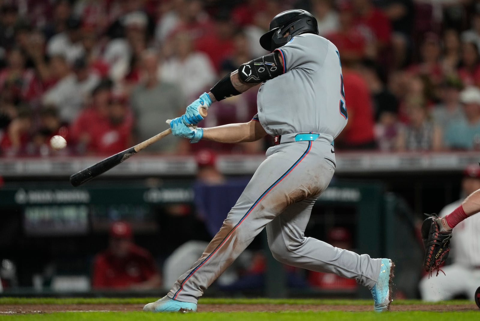 Miami Marlins' Agustín Ramírez hits a solo home run during the seventh inning of a baseball game against the Cincinnati Reds in Cincinnati, Monday, July 7, 2025. (AP Photo/Carolyn Kaster)