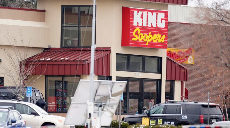 Police work on the scene outside of a King Soopers grocery store where a shooting took place Monday, March 22, 2021, in Boulder, Colo. (AP Photo/David Zalubowski)