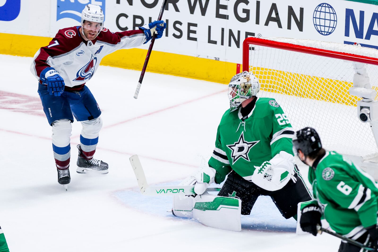 Colorado Avalanche defenseman Devon Toews (7) celebrates scoring past Dallas Stars goaltender Jake Oettinger (29) during a first-round NHL hockey playoff game in Dallas, Saturday, April 19, 2025. (AP Photo/Gareth Patterson)
