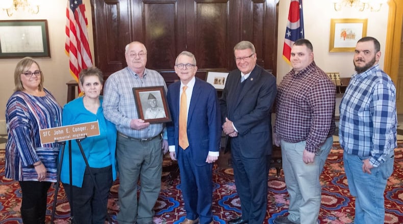 The family of SFC John E. Conger with Governor Mike DeWine and Ohio Senator Steve Wilson