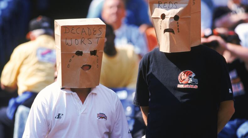 3 Oct 1999: Fans of the Cincinnati Bengals wear unhappy paper bag faces crying about the Cincinnati Reds worst season during a game against the St. Louis Rams at the Riverfront Stadium in Cincinnati, Ohio. The Rams defeated the Bengals 38-10. Mandatory Credit: Andy Lyons /Allsport