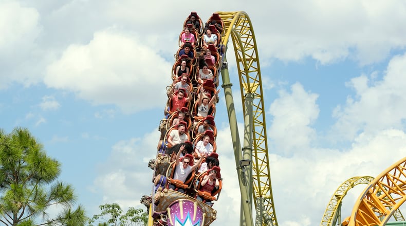 FILE - Guests ride on the Stardust Racers roller coaster at Epic Universe Theme Park at Universal Resort Orlando, April 10, 2025, in Orlando, Fla. (AP Photo/John Raoux, file)