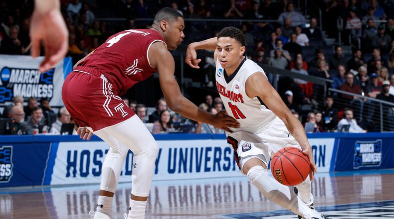 DAYTON, OHIO - MARCH 19: Kevin McClain #11 of the Belmont Bruins dribbles against J.P. Moorman II #4 of the Temple Owls during the first half in the First Four of the 2019 NCAA Men’s Basketball Tournament at UD Arena on March 19, 2019 in Dayton, Ohio. (Photo by Joe Robbins/Getty Images)