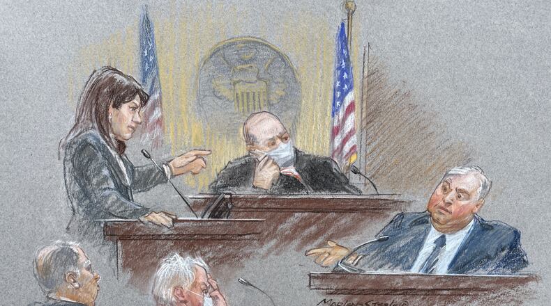 Prosecutor Emily Glatfelter cross examines Larry Householder while an attorney for co-defendant Matt Borges holds his head in his hand. MARLENE STEELE VIA WCPO