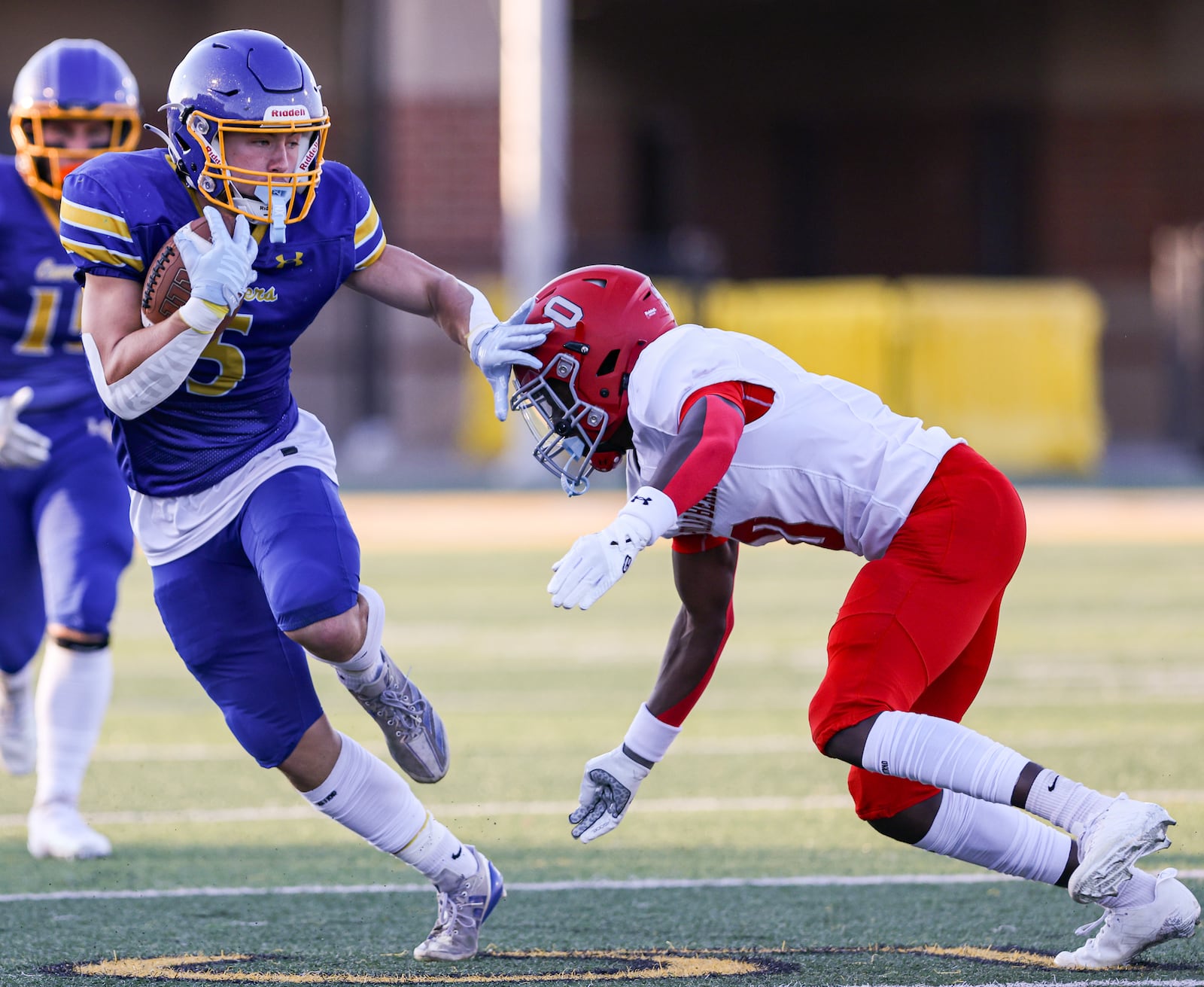 Lehman Catholic senior receiver Evan O'Leary tries to avoid Northridge's Sulaiman Muhhamed during a Three Rivers Conference game on Thursday, Sept. 11 at Sidney Memorial Stadium. The Cavaliers pulled away in the second half to a 34-16 win. BRYANT BILLING / STAFF