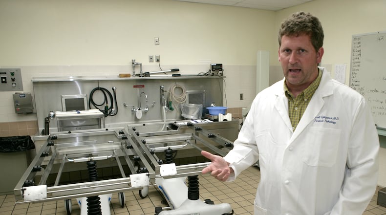 Dr. Russell Uptegrove is the county coroner in Warren County and a full-time forensic pathologist in Montgomery County. TY GREENLEES/STAFF