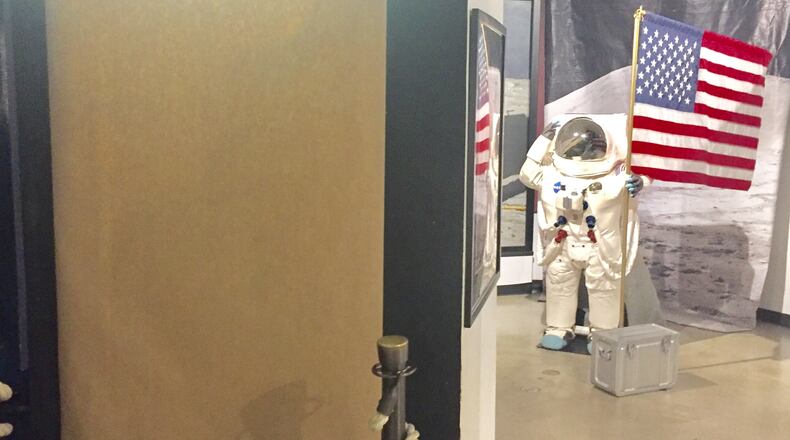 The exhibit that showcased the golden lunar space module, which was taken from the Armstrong Air and Space Museum late Friday night, has been covered up as multiple entities are investigating the theft of the rare artifact. STAFF/STEVE BAKER