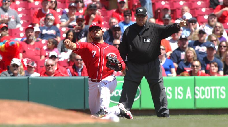 Reds third baseman Eugenio Suarez throws to first for an out against the Braves on Thursday, April 26, 2018, at Great American Ball Park in Cincinnati. It was his first career home run. David Jablonski/Staff