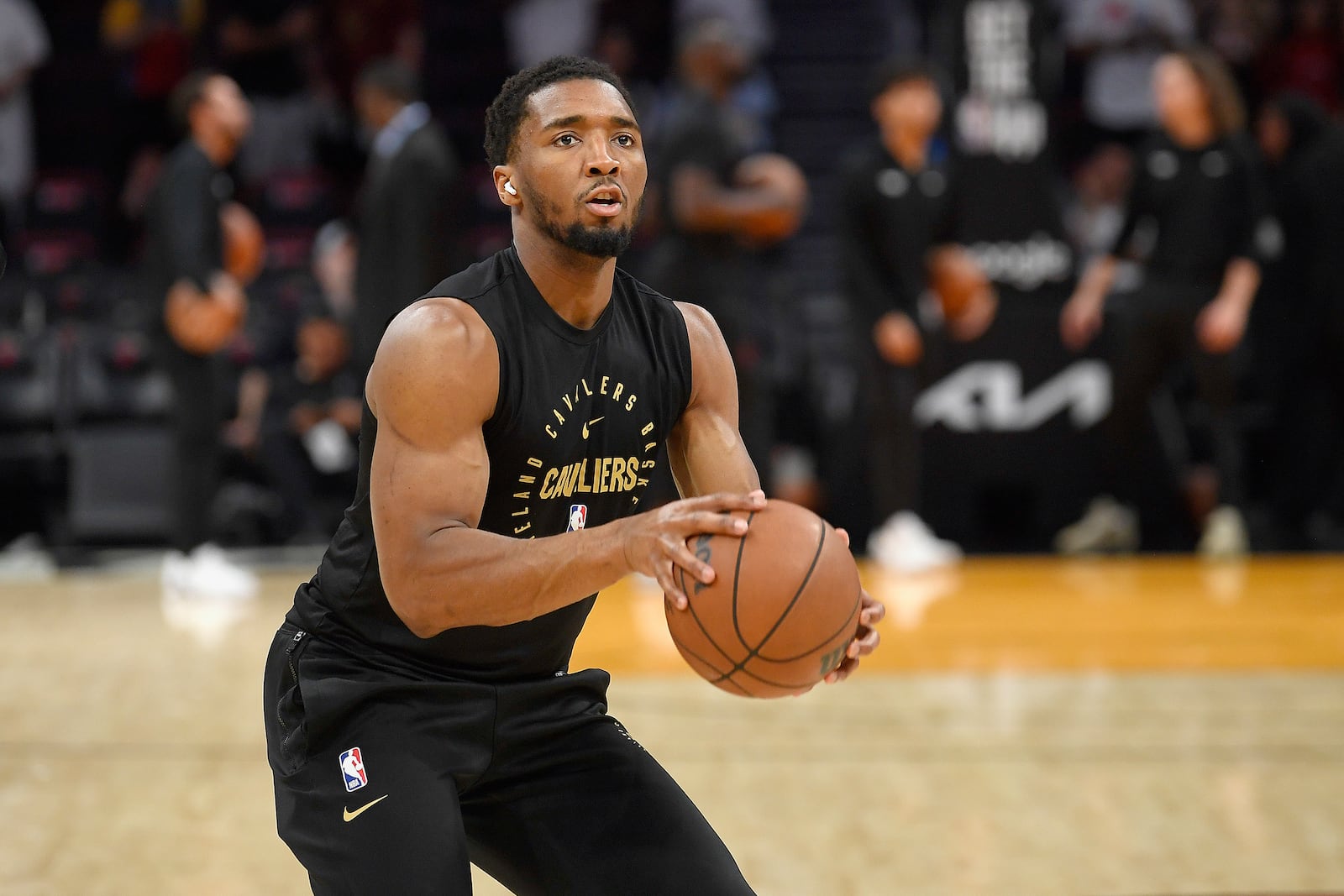 Cleveland Cavaliers guard Donovan Mitchell warms up before Game 3 of an NBA basketball first-round playoff series against the Miami Heat, Saturday, April 26, 2025, in Miami. (AP Photo/Michael Laughlin)