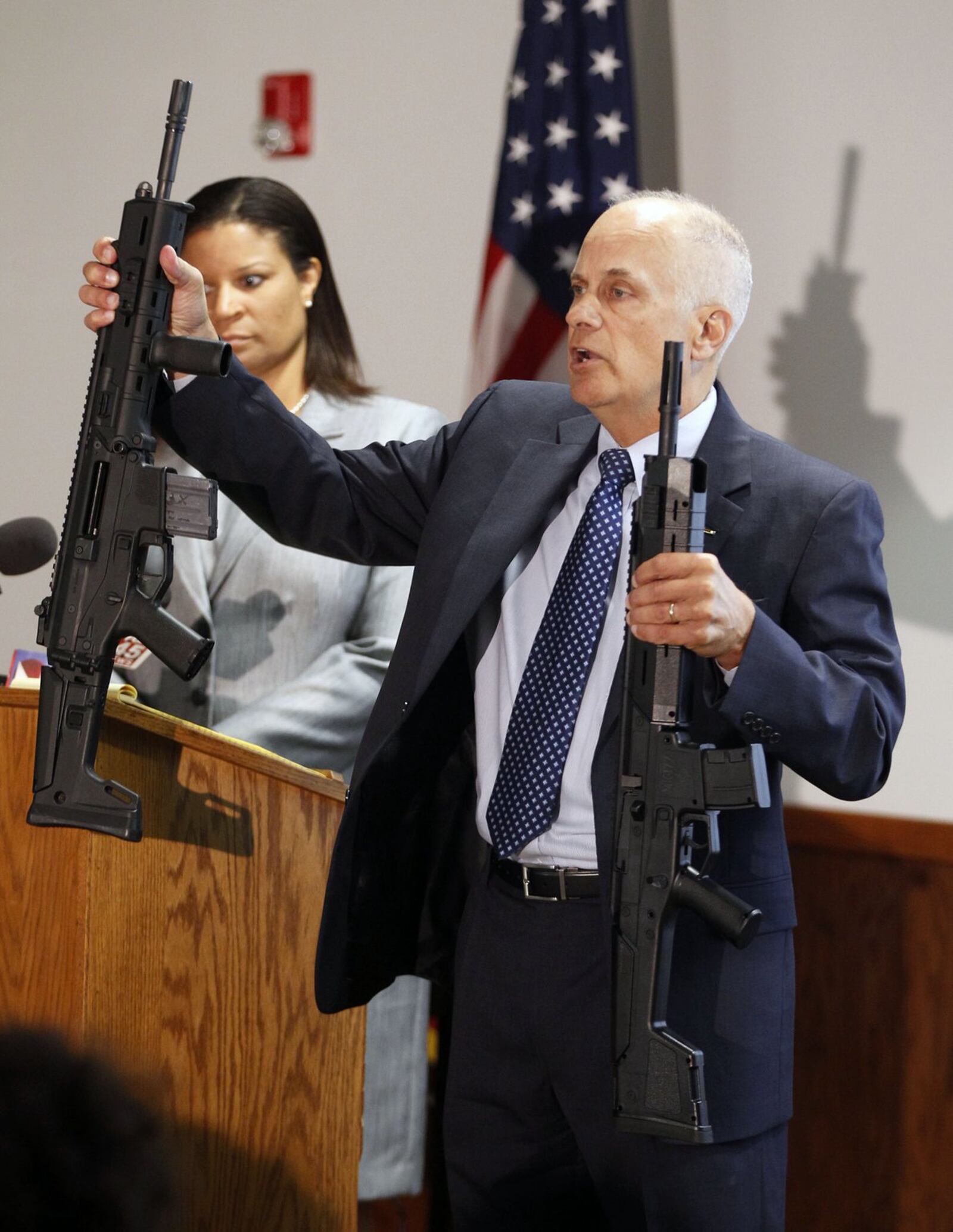 Special Prosecutor Mark Piepmeier addresses media members after a Greene County Grand Jury returned no indictment against Beavercreek Police officers involved in the fatal shooting of John Crawford III, who was carrying a realistic-looking pellet gun in the Beavercreek Walmart. The gun at left is a centerfire rifle, the gun on the right is a pellet rifle. TY GREENLEES / STAFF