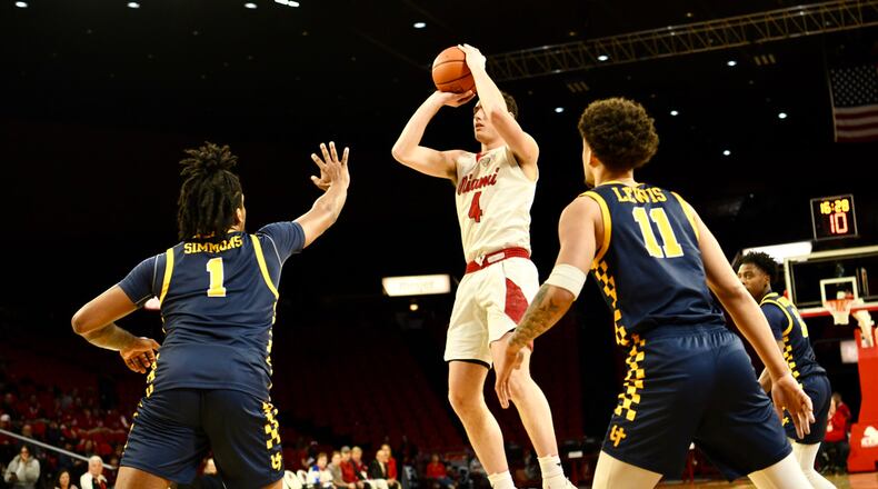 Miami's Kam Craft hangs to shoot in traffic during Tuesday night's game vs. Toledo at Millett Hall. Craft scored a career-high 40 points in the RedHawks' win. Miami Athletics photo