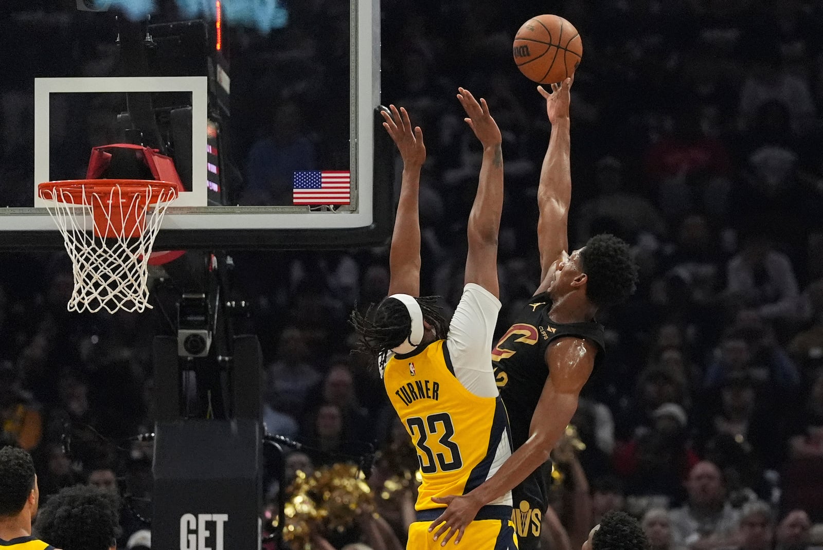 Cleveland Cavaliers forward De'Andre Hunter, right, shoots as Indiana Pacers center Myles Turner defends during the first half in Game 5 of an Eastern Conference semifinal NBA basketball playoff Tuesday, May 13, 2025, in Cleveland. (AP Photo/Sue Ogrocki)