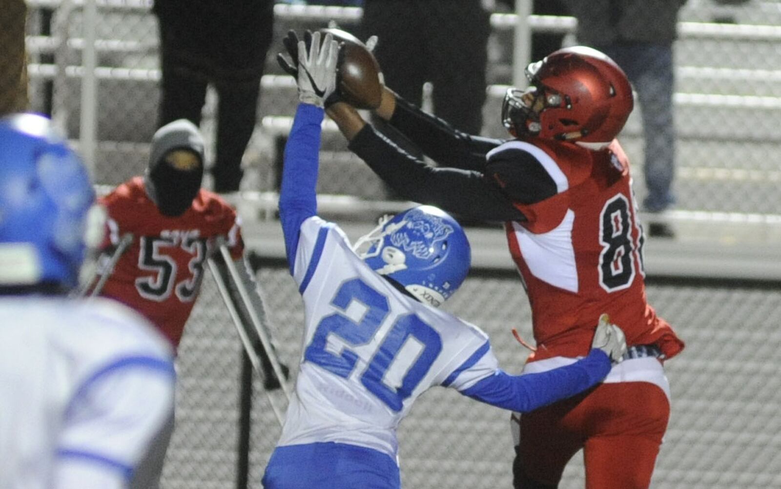 Trotwood’s Justin Stephens makes a catch over Dunbar’s Jamar Payton. Trotwood-Madison defeated Dunbar 64-26 in a D-III, Region 12 high school football playoff semifinal at Butler on Friday, Nov. 10, 2017. MARC PENDLETON / STAFF