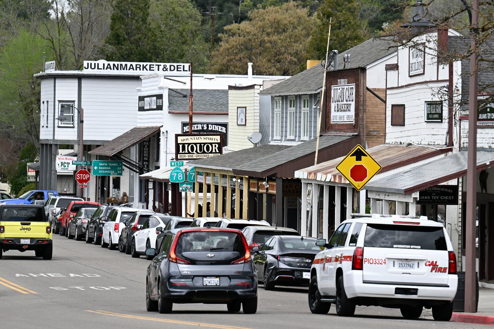 Cars drive on the main street in Julian, Calif. Monday, April 14, 2025, after an earthquake shook Southern California, sending boulders tumbling onto rural roadways outside San Diego and rattling items off shelves and walls. (AP Photo/Denis Poroy)