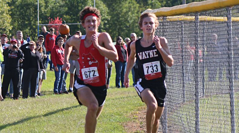 Wayne’s Lucas Houk (right) and Milton-Union’s Shannon Milnickel race to the finish in Saturday’s Brookville Invitational. Greg Billing/Contributed photo