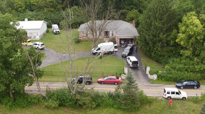 Investigators from the Ohio Bureau of Criminal Investigation searched property at 5531 Hemple Road in Moraine on Friday in connection with known missing persons. TY GREENLEES / STAFF