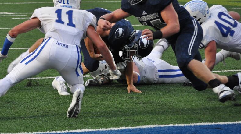 Fairmont junior Jesse Deglow throws a block as teammate Braden Miller tries to regain his balance near the end zone during the Firebirds’ 40-38 win at Rousch Stadium Friday, Sept. 15. Nick Dudokovich/CONTRIBUTED