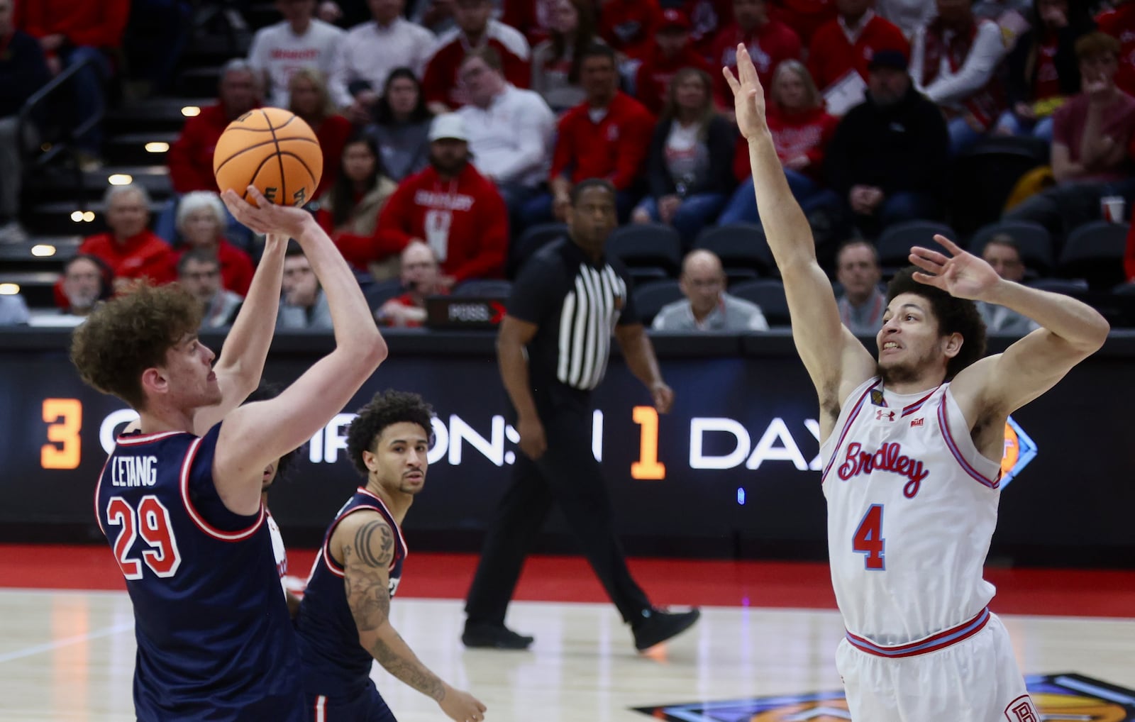 Dayton's Amaël L'Etang shoots in the first half against Bradley in the first round of the National Invitation Championship on Wednesday, March 18, 2026, at Carver Arena in Peoria, Ill. David Jablonski/Staff