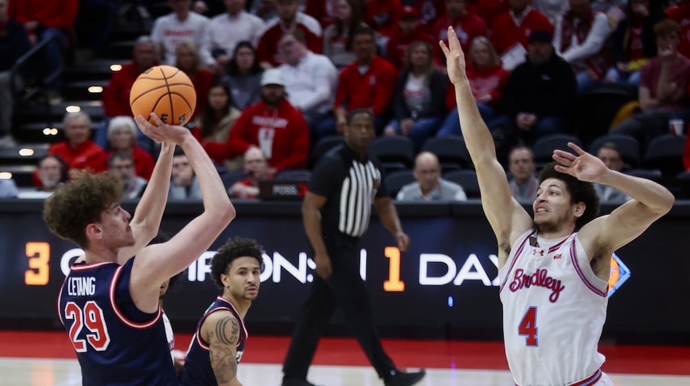 Dayton's Amaël L'Etang shoots in the first half against Bradley in the first round of the National Invitation Championship on Wednesday, March 18, 2026, at Carver Arena in Peoria, Ill. David Jablonski/Staff