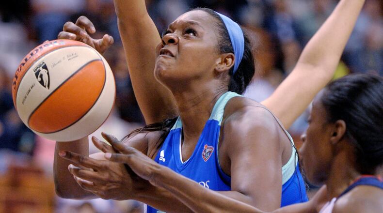FILE - New York Liberty's Kara Braxton is fouled by Connecticut Sun's Kalana Greene during a WNBA exhibition basketball game, May 7, 2012, in Uncasville, Conn. (Sean D. Elliot/The Day via AP)