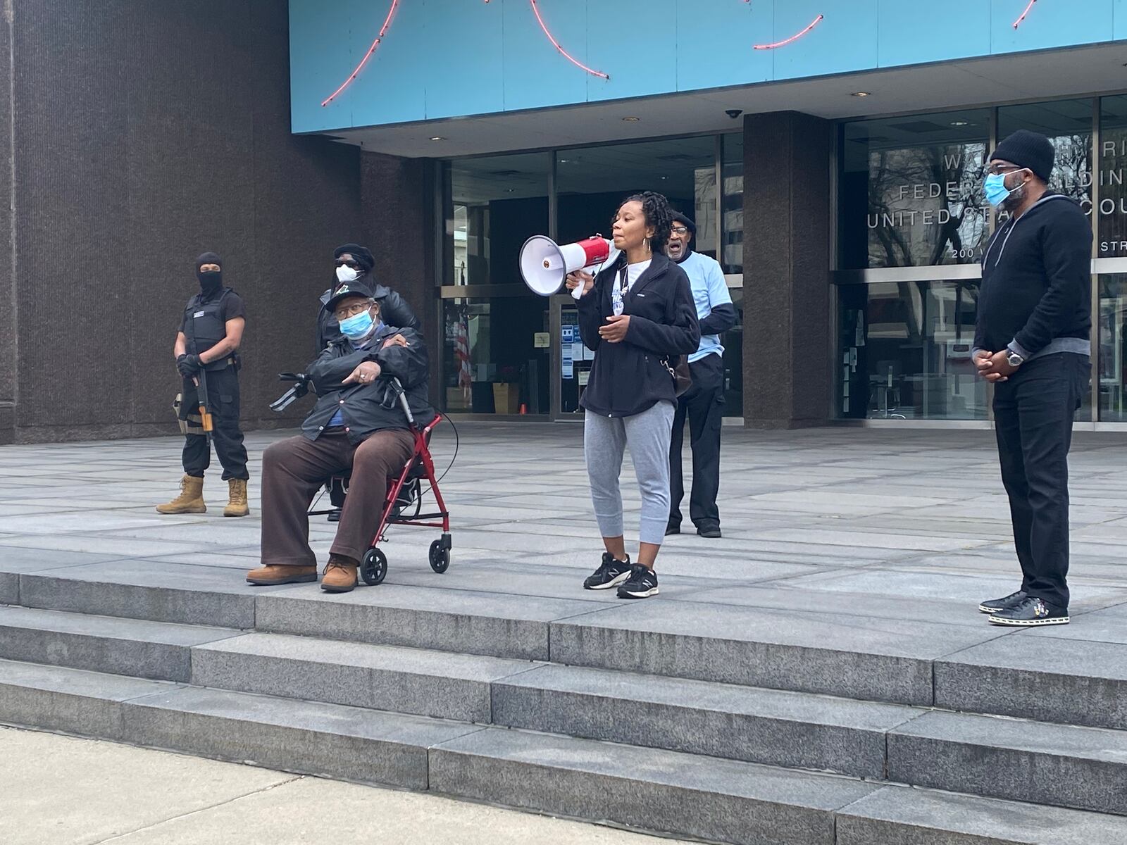 Shenise Turner-Sloss, a candidate for Dayton City Commission, speaks at a protest on Saturday in front of the Dayton Federal Building.  Eileen McClory / Staff