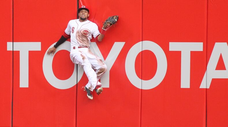 Reds center fielder Billy Hamilton makes a catch against the Brewers on Thursday, April 13, 2017, at Great American Ball Park in Cincinnati. David Jablonski/Staff