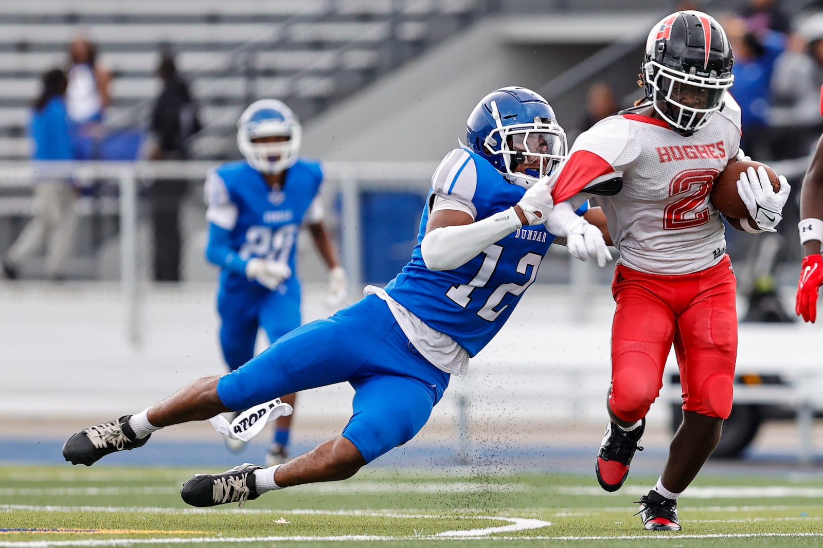 The Dunbar High School football team fell to Cincinnati Hughes 20-0 in their season opener on Thursday, Aug. 21 at Welcome Stadium. MICHAEL COOPER / STAFF