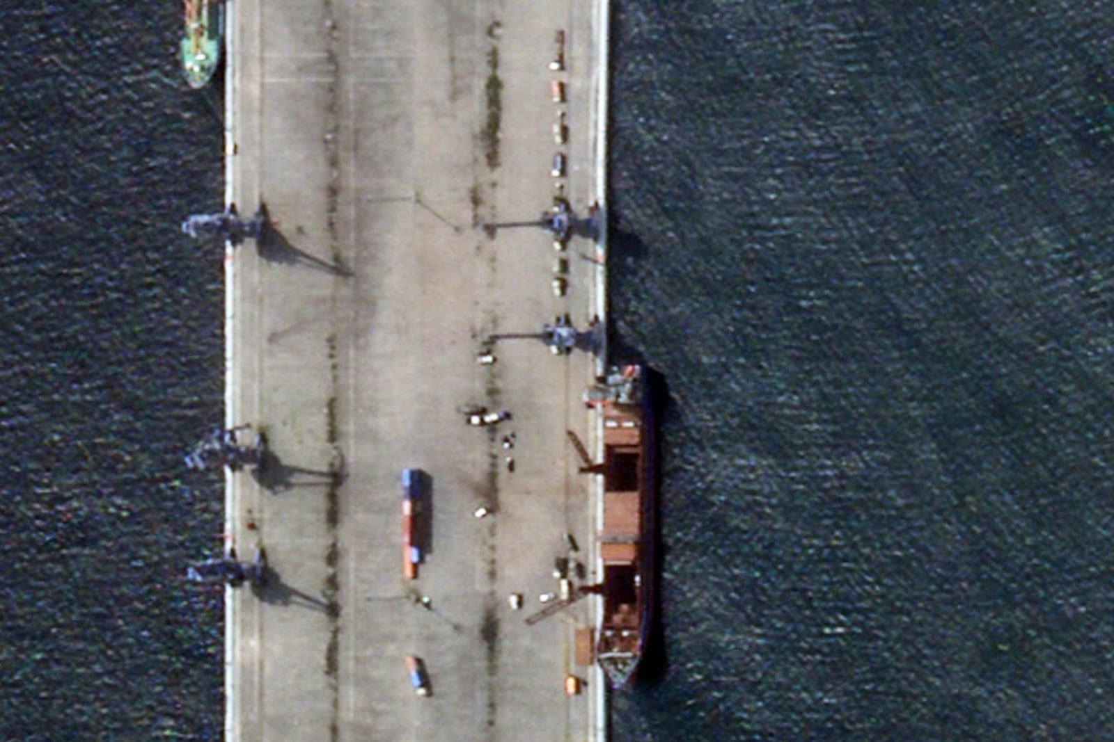 This satellite image provided by Planet Labs PBC shows trucks lined up on a dock as the Russian-flagged cargo ship, Siyanie Severa, unloads its cargo, May 29, 2025, in Bata, Equatorial Guinea. (Planet Labs PBC via AP)